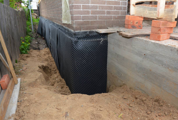 SJ Waterproofing Pros technician performing targeted Emergency Waterproofing assessment in Kenvil, NJ
